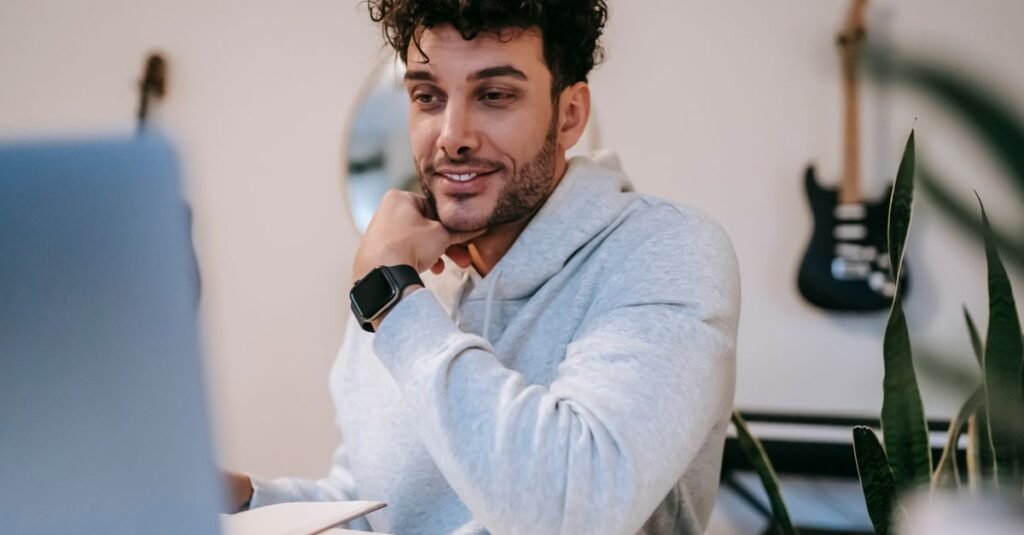 Freelancer working on a laptop at a home office desk
