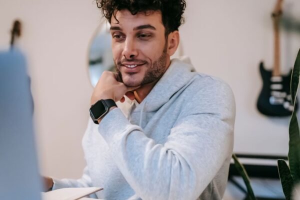 Freelancer working on a laptop at a home office desk