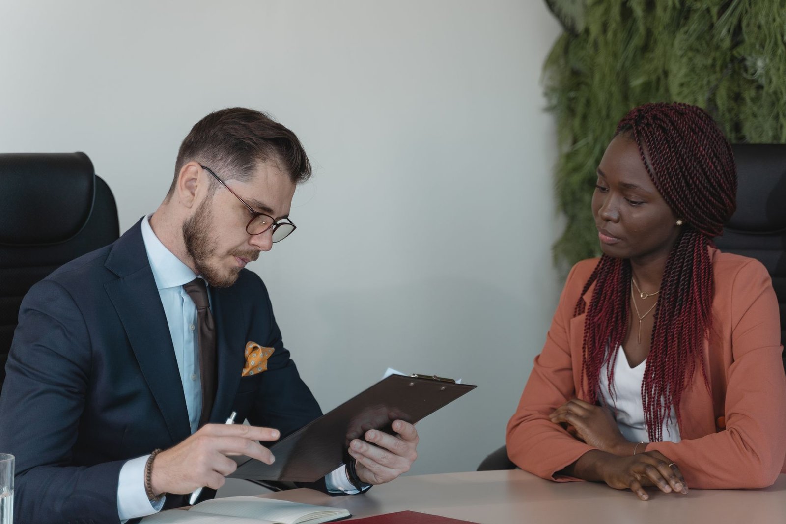 Hiring manager reviewing a job candidate resume during an interview