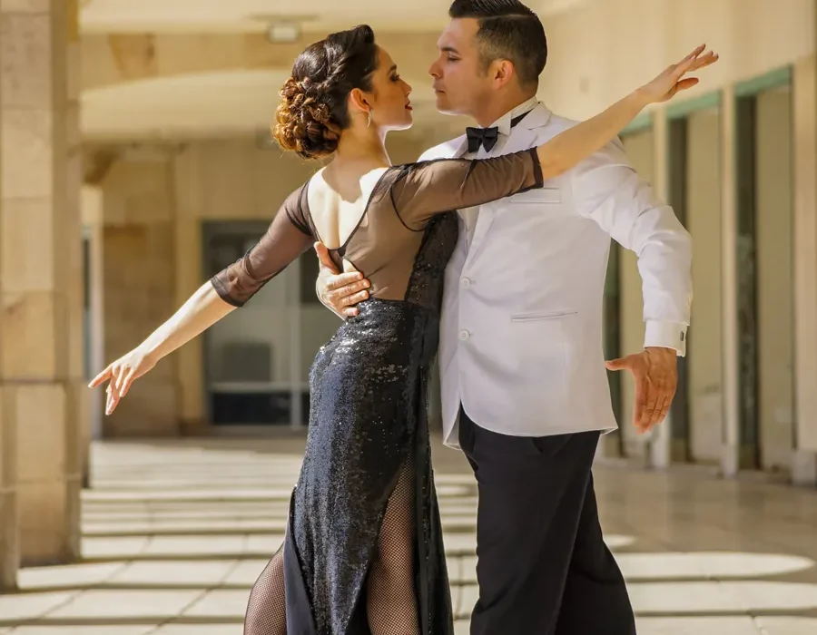 Ballroom dancing couple performing under stage lights on Strictly Come Dancing
