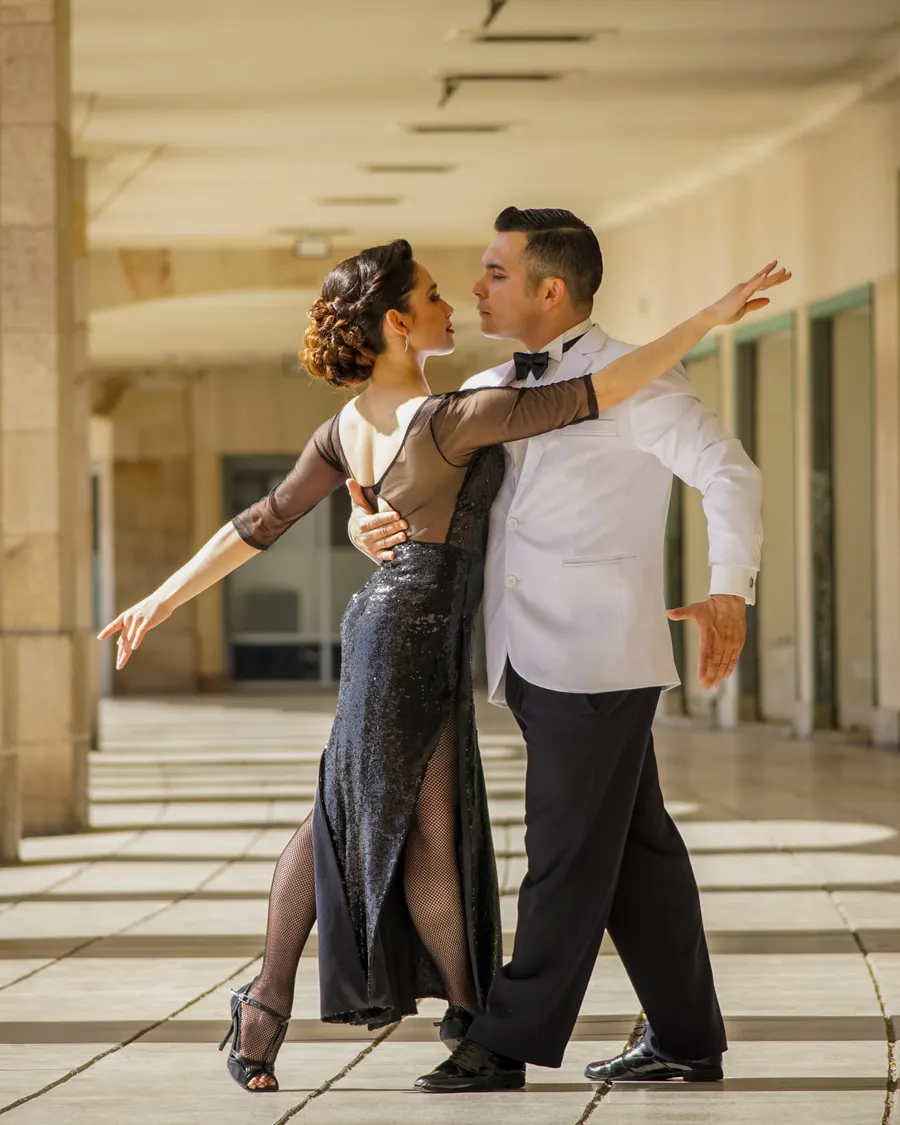 Ballroom dancing couple performing under stage lights on Strictly Come Dancing
