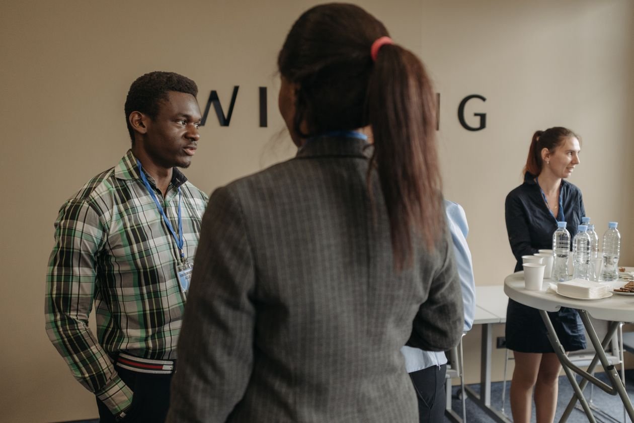 Professionals networking at an indoor business seminar