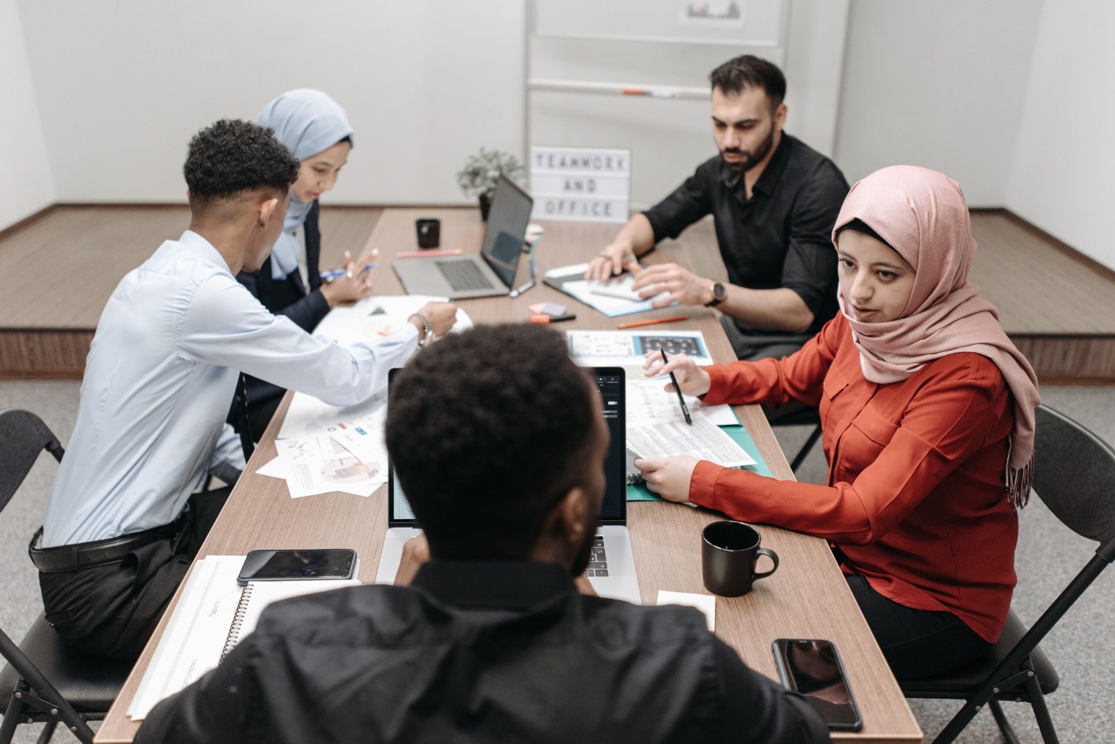 Small business focus group participants discussing ideas around a table