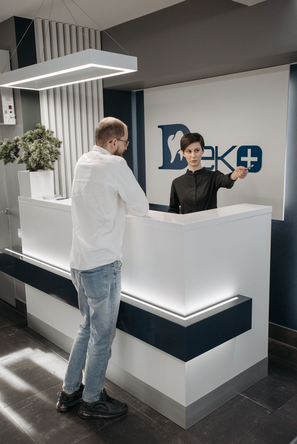 Dental clinic reception desk where staff manage patient appointments