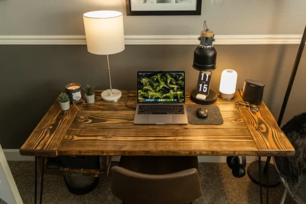 Home office desk with laptop set up for creating digital products.