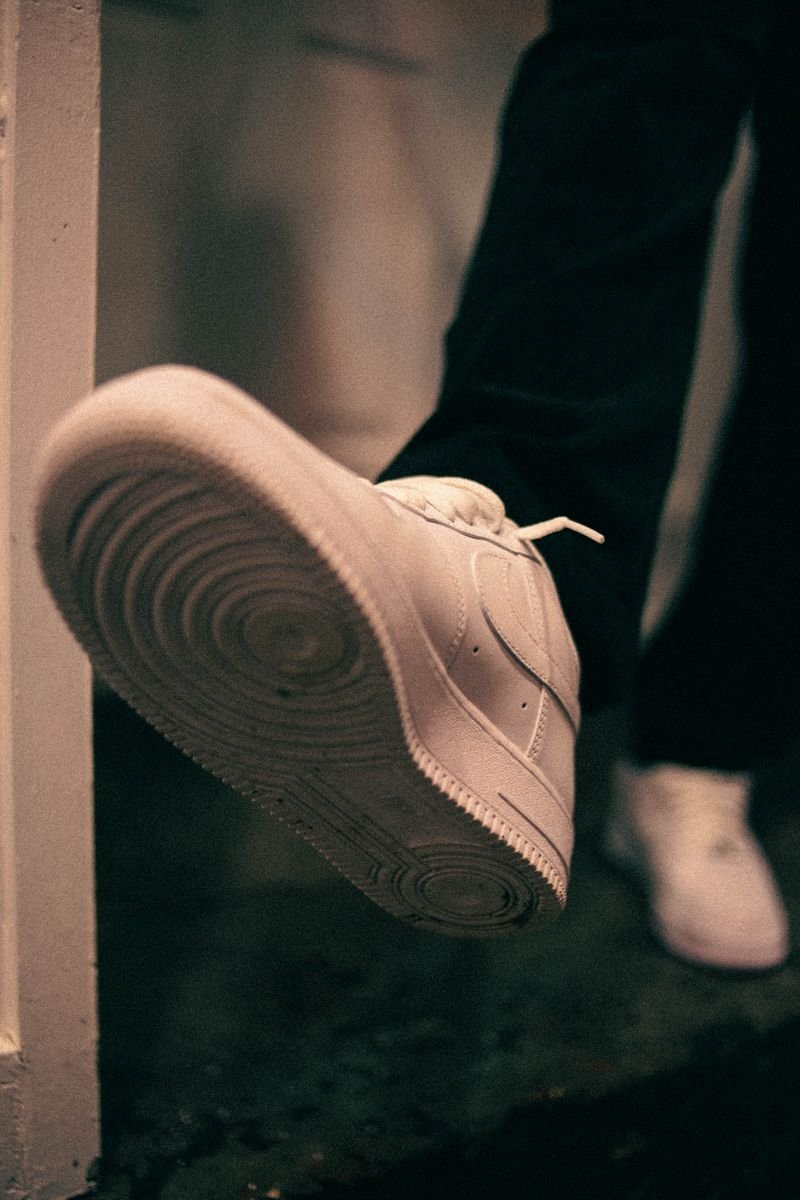 Close up of a white sneaker sole showing early signs of yellowing