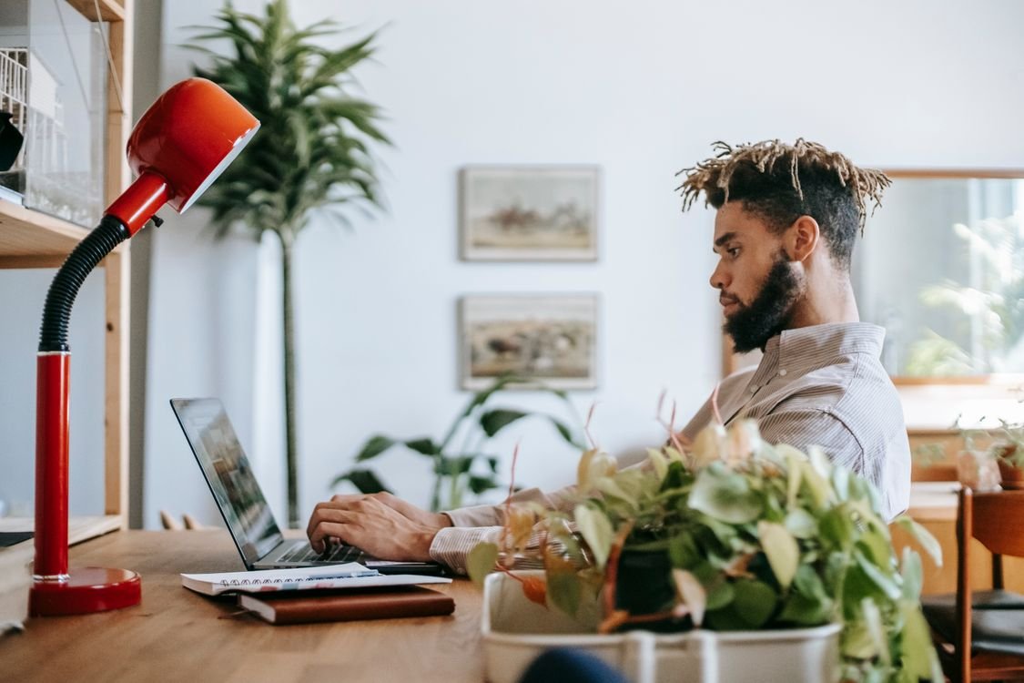 Team member installing a password manager browser extension at a tidy desk