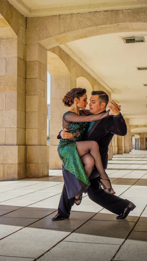 Couple practising ballroom dancing in a rehearsal studio for Strictly