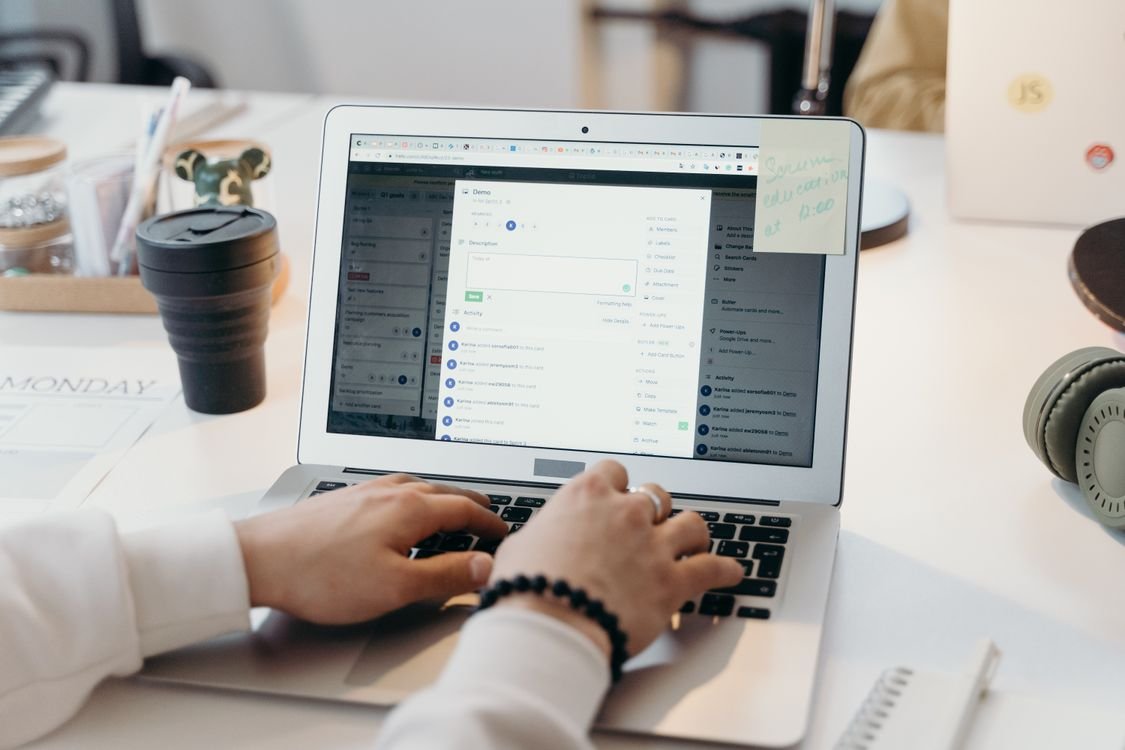 Person drafting a professional email at a bright office desk