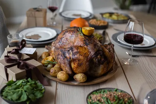 Roasted turkey served on a Thanksgiving dinner table