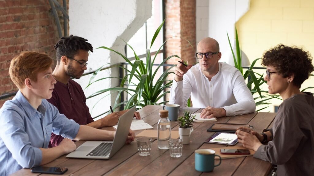 Small business team reviewing company policies together in a meeting