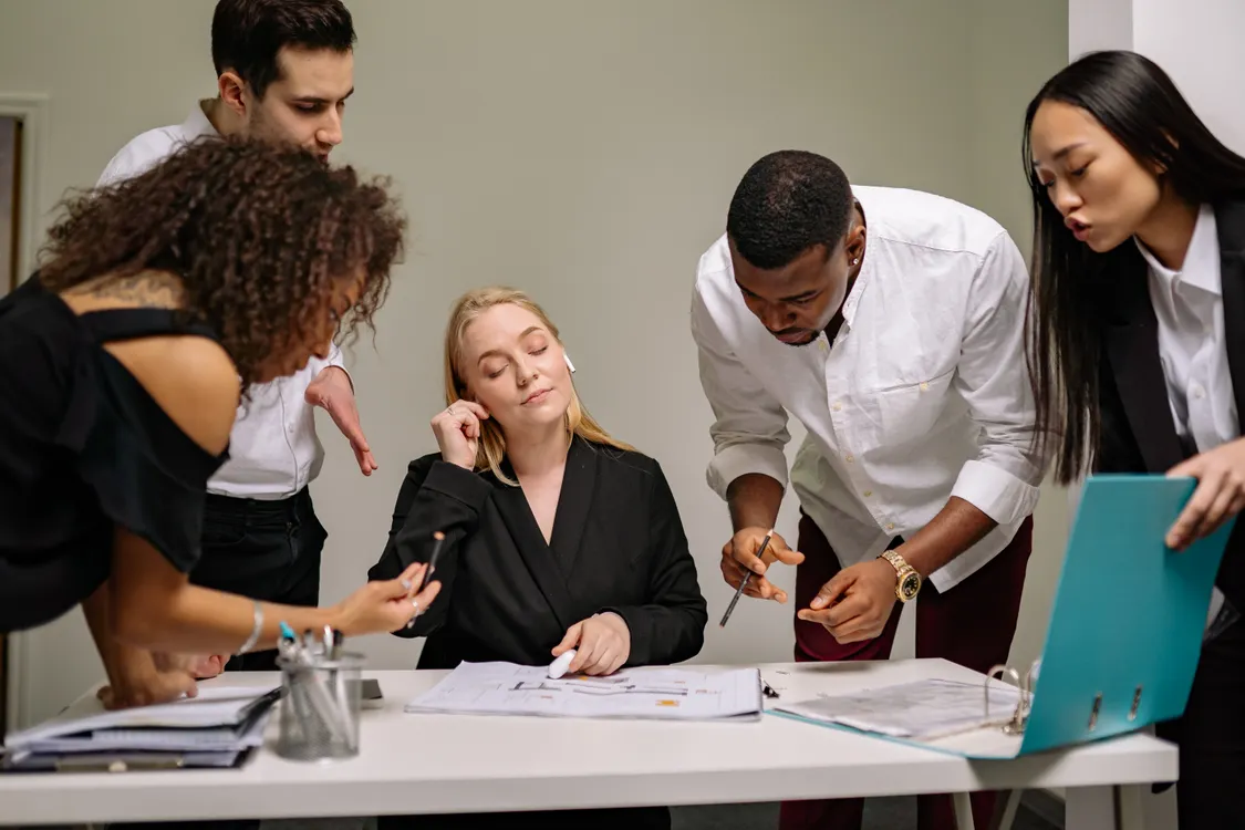 Small business team reviewing automated processes together in a meeting
