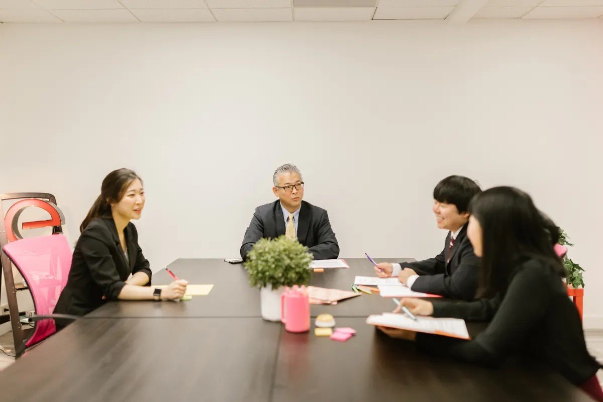 Japanese business team holding a meeting in a conference room