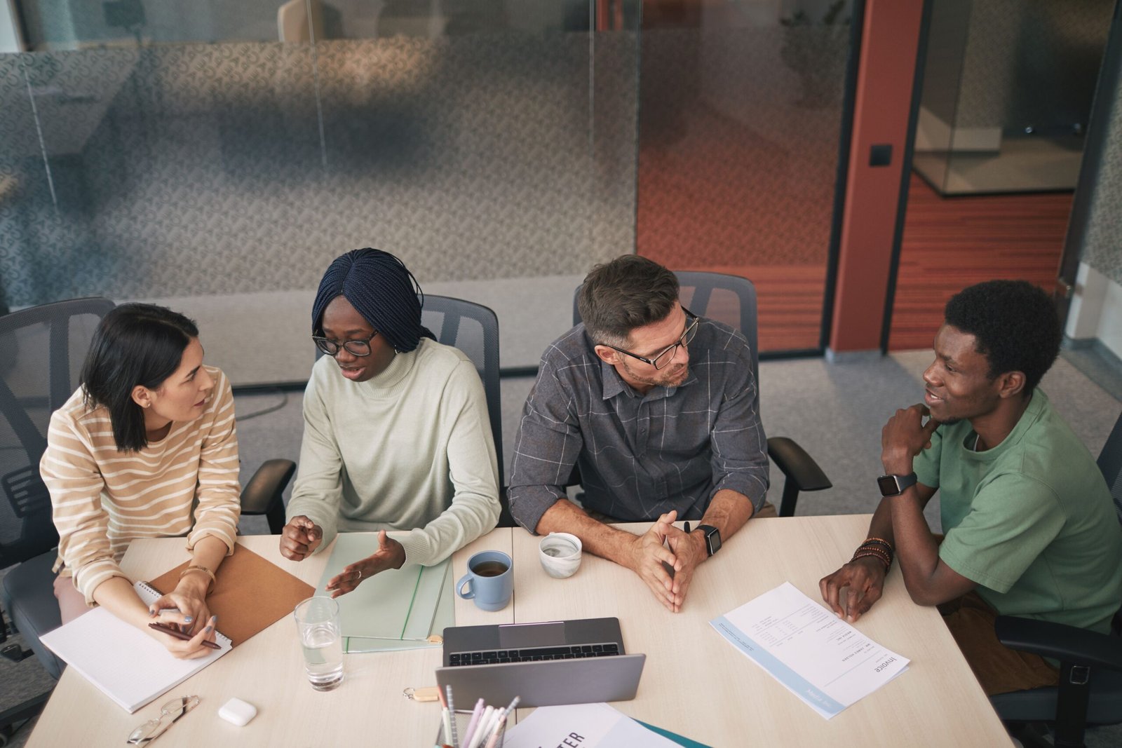 Four focus group participants talking during a small business research session