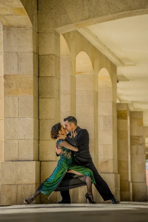 Celebrity and professional dancer rehearsing a ballroom routine together