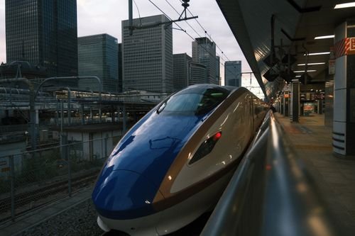 Shinkansen bullet train waiting at Tokyo station platform