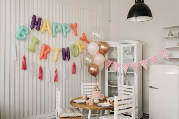 Simple DIY balloons and streamers decorating an office for a staff party