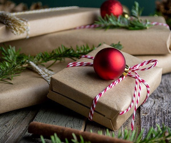 Beautifully wrapped Christmas gifts with ribbons and festive decorations